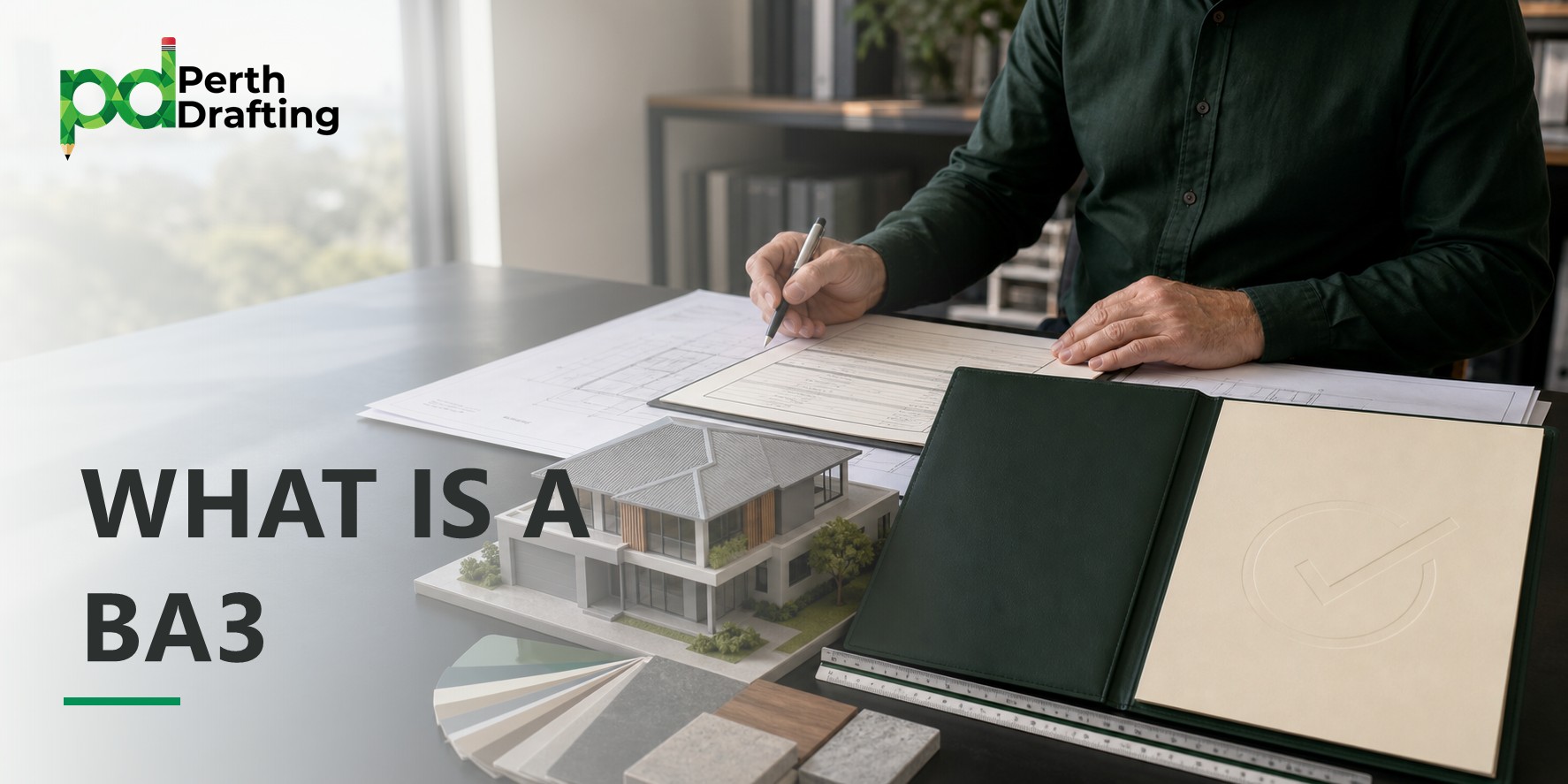A person wearing a dark green shirt sitting at a desk, using a pen to fill out official documents on top of architectural plans. On the table sits a detailed mini 3D scale model of a modern two-story home, color swatches, material samples, and an open dark-green document folder with a checkmark symbol embossed on it.